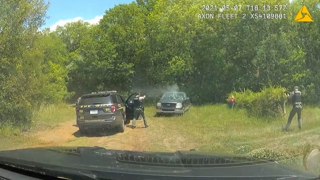 This image provided by York County Sheriff's Office and released by attorney Justin Bamberg shows police dash cam video of Trevor Mullinax's encounter with York County deputies in May 2021.  Mullinax is suing the sheriff's office in South Carolina saying deputies shot at him about 50 times when he was having a mental health crisis in a parked truck with a shotgun in his lap, even though he says his hands were raised.