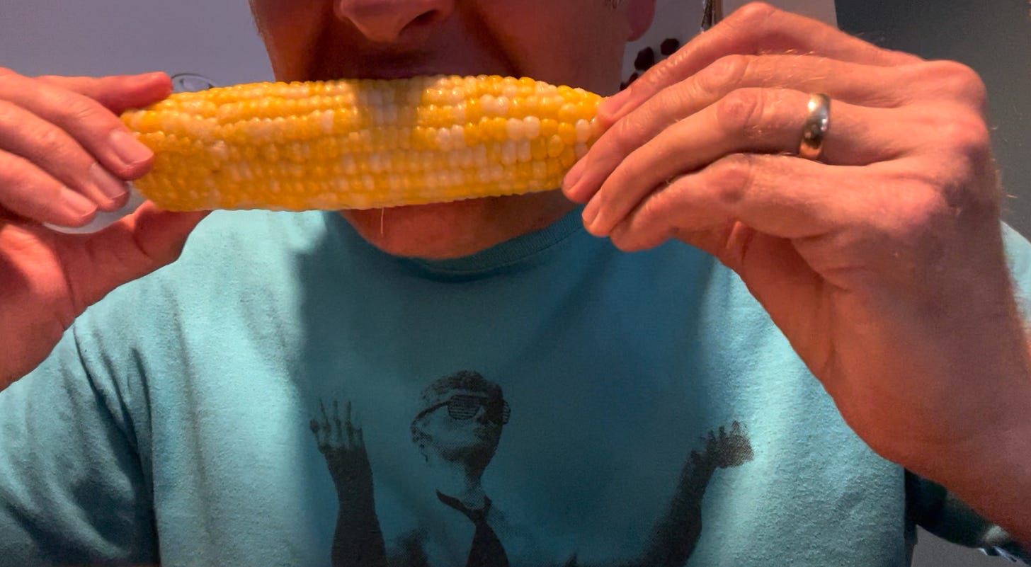 Dr. Dave gnawing on an ear of buttered sweetcorn
