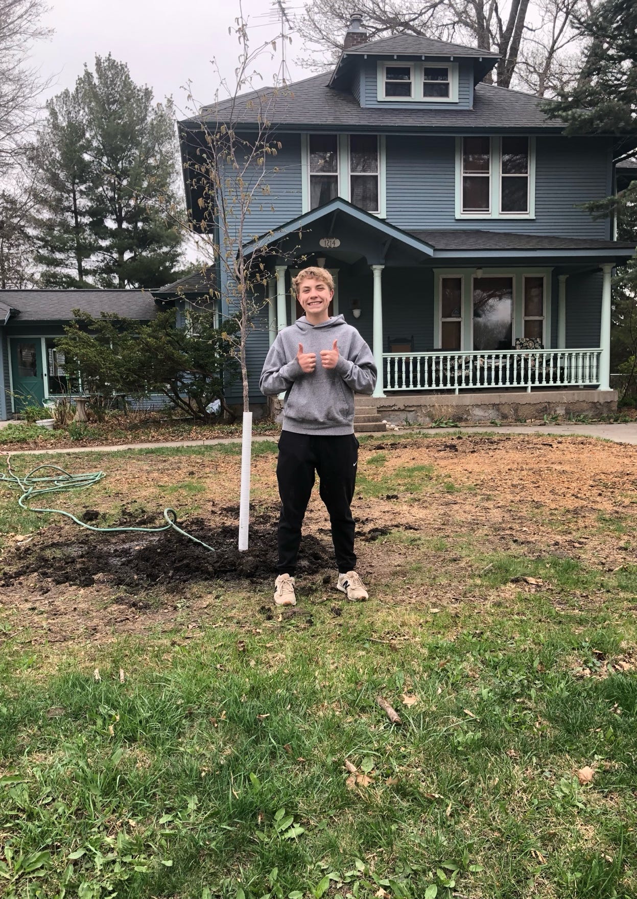 A child standing in front of a house

AI-generated content may be incorrect.