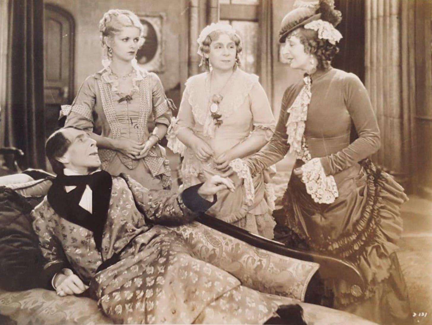 George Arliss, Joan Bennett, Florence Arliss, and Doris Lloyd in a scene from Disraeli