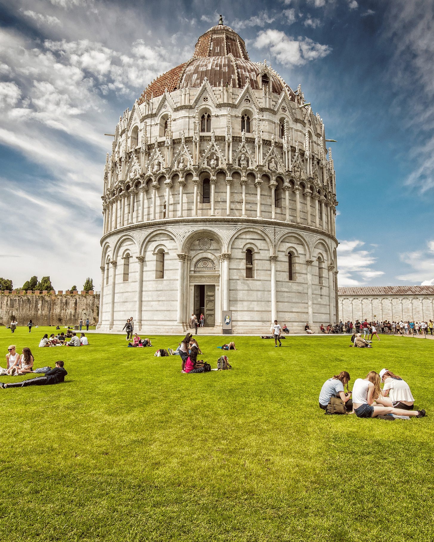 May be an image of 9 people, the Leaning Tower of Pisa and bell tower