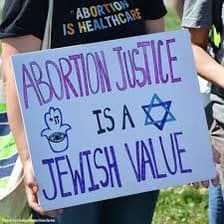 May be an image of 1 person and text that says 'ABOR 0 HEALTHCA ABORTION JUSTICE 色 ISAA JEWISH VALLUE'
