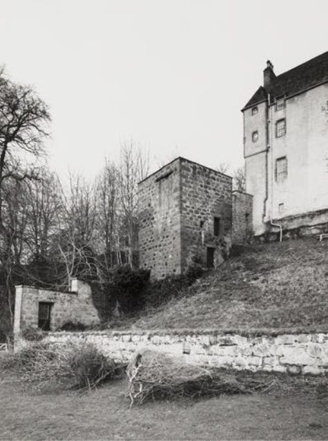 The doocot at Kilravock Castle (centre), built into the side of a slope.