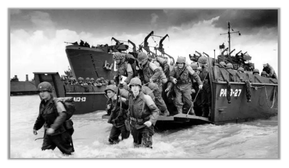 Soldiers are pictured wading through the water and coming ashore during Exercise Tiger.