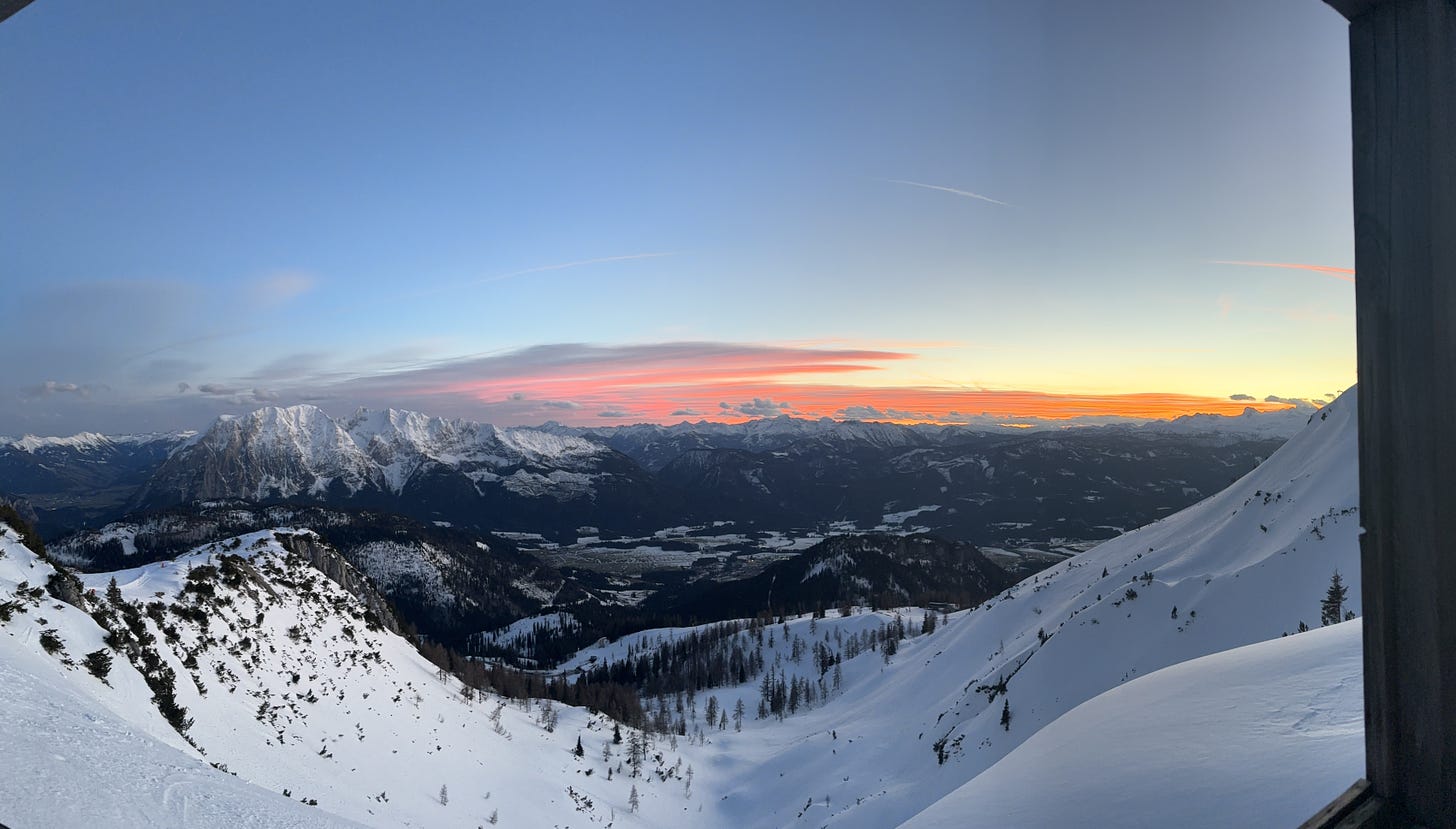 A beautiful mountain, splashed in orange, pink and purple clouds.