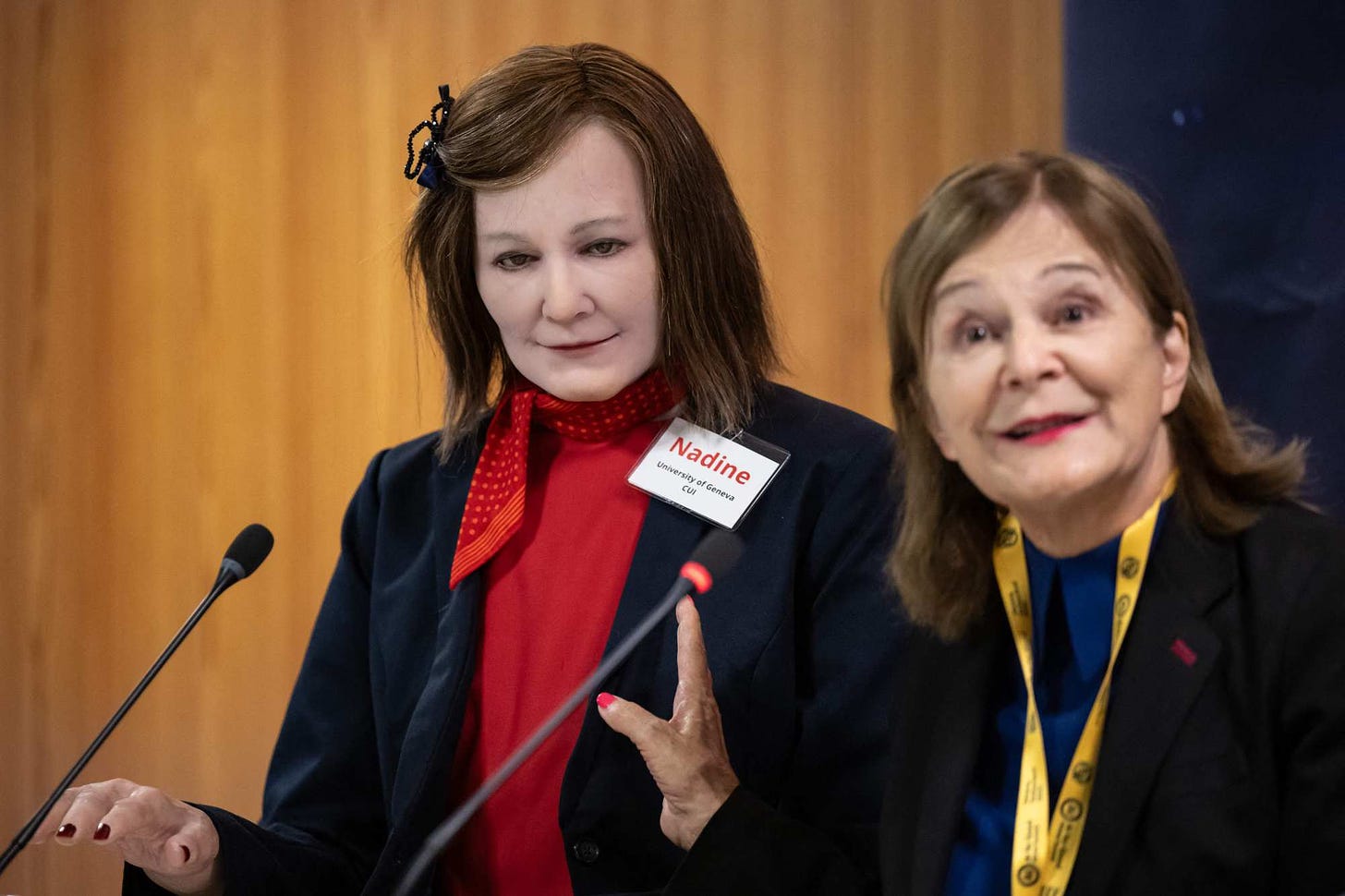 AI-powered humanoid social robot Nadine, left, modelled on professor Nadia Magnenat Thalmann, right, at the International Telecommunication Union (ITU) AI for Good Global Summit in Geneva, Switzerland on Friday. Photo: AFP