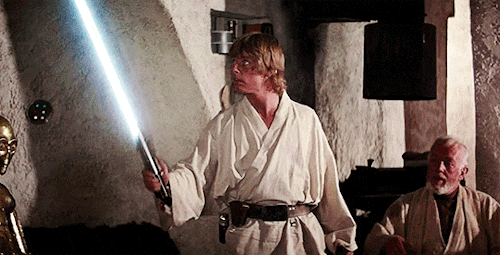 Luke testing out his lightsaber in Star Wars: A New Hope