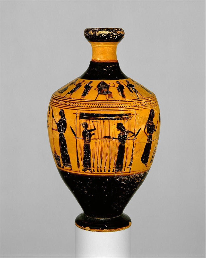 Color photograph of a Greek Vase with black figures of women engaged in weaving activities