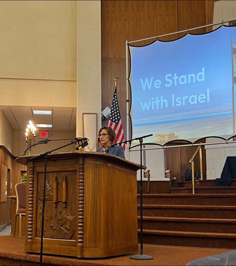 May be an image of 1 person and text that says 'We Stand with Israel'
