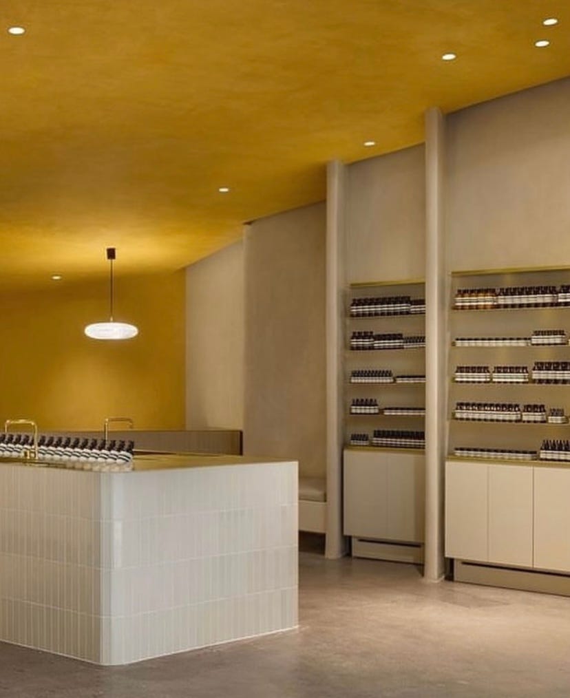 aesop beauty store with yellow ceiling