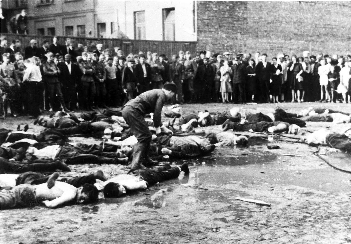 Lithuanian nationalists clubbing Jewish Lithuanians to death. Kovno (Kaunas), Lithuania, June 27, 1941.