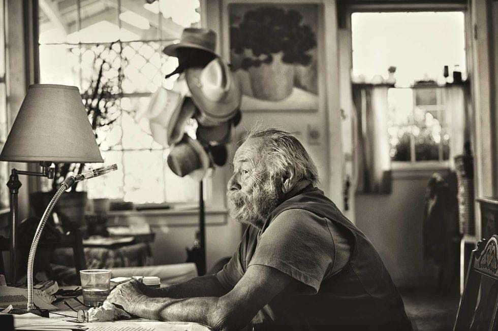 May be a black-and-white image of 1 person, studying, hat and hat shop