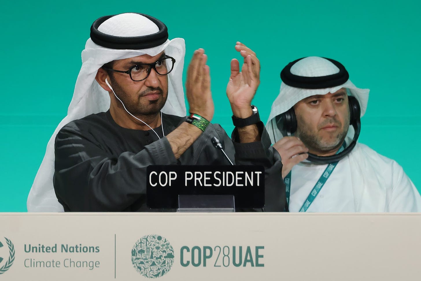 COP28 President Sultan Ahmed al-Jaber and COP28 Director-General Majid al-Suwaidi attend a plenary session.