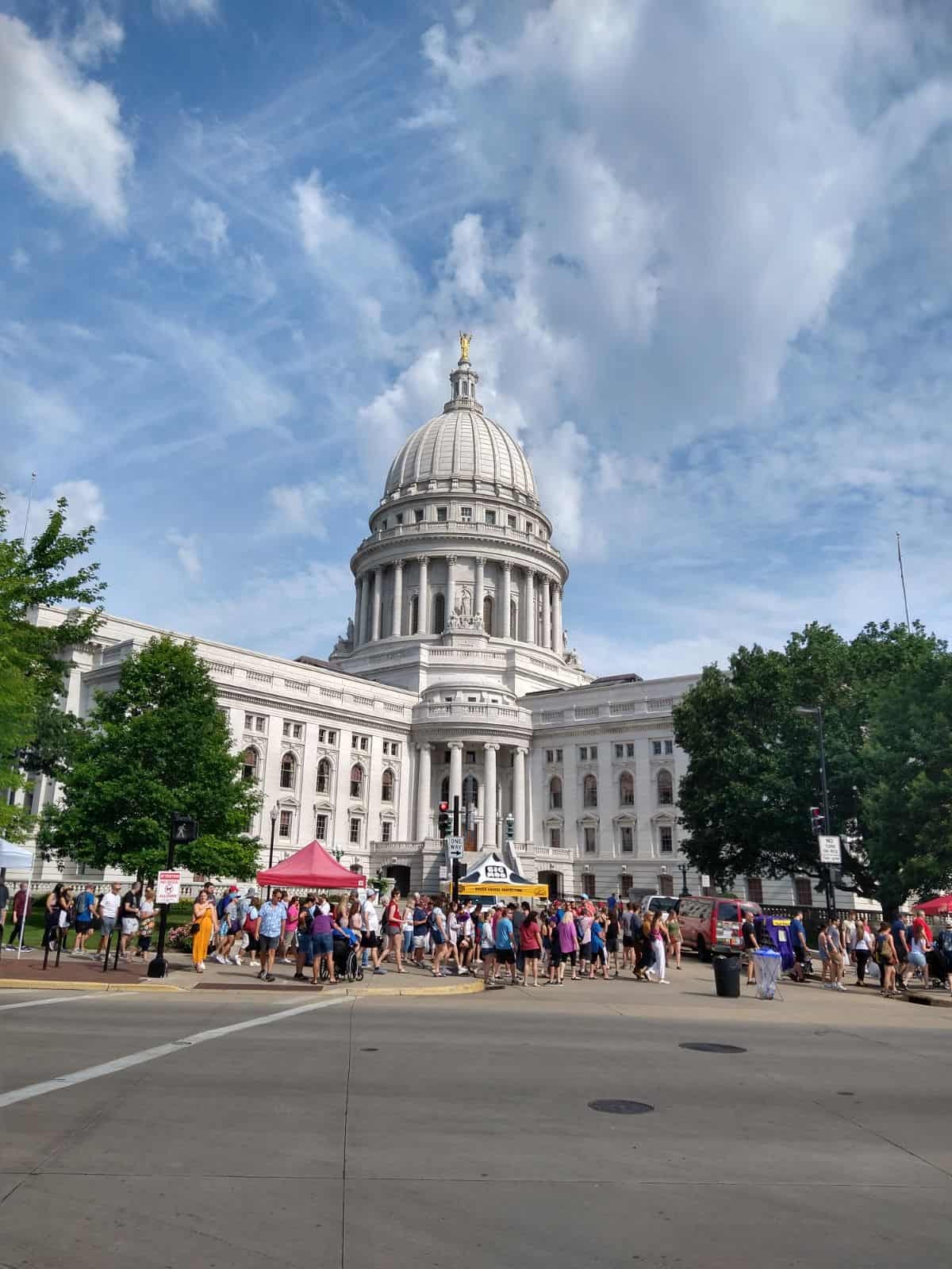 The capitol building at Madison, Wisconsin with the farmers market surrounding it.