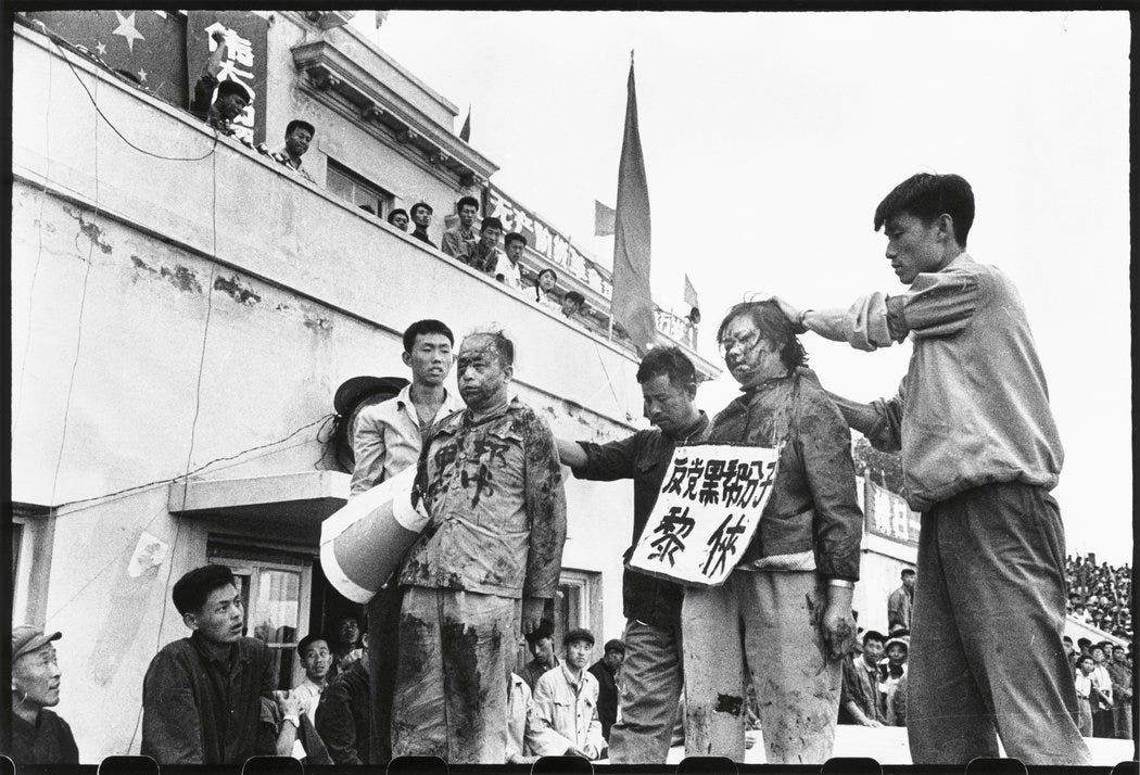 Li Zhensheng, photographer of China's Cultural Revolution, dies today.  Here's one of his invaluable works: During a struggle session, a special  form of public humiliation and torture used in Mao era, a