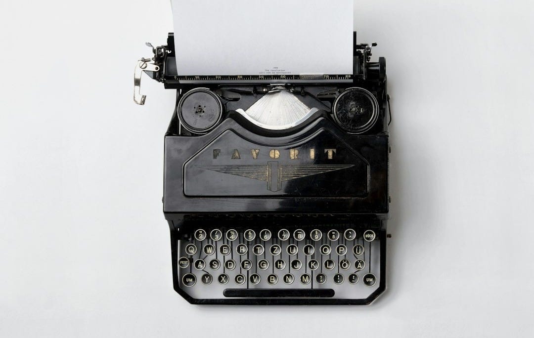 black Fayorit typewriter with printer paper black Fayorit typewriter with printer paper