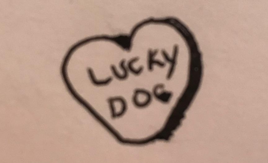 heart with "lucky dog" written in the middle