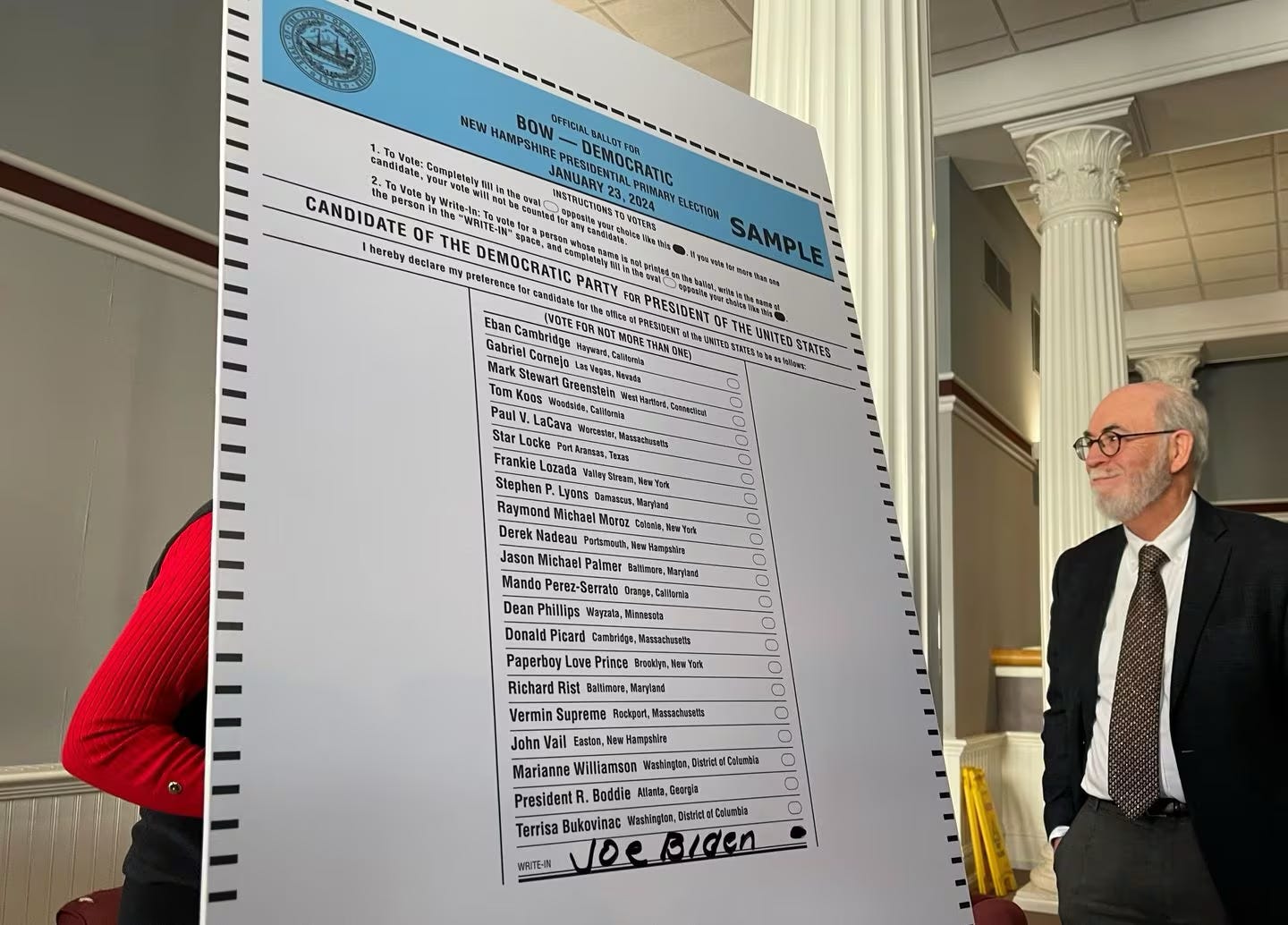 New Hampshire state Senator David Watters (right) and state Representative Angela Brennan, both Democrats, displayed a giant sample ballot in Concord, N.H.