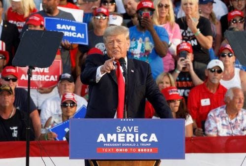 Former President Donald Trump points at the press box speaks of Former President Donald Trump points at the press box speaks of