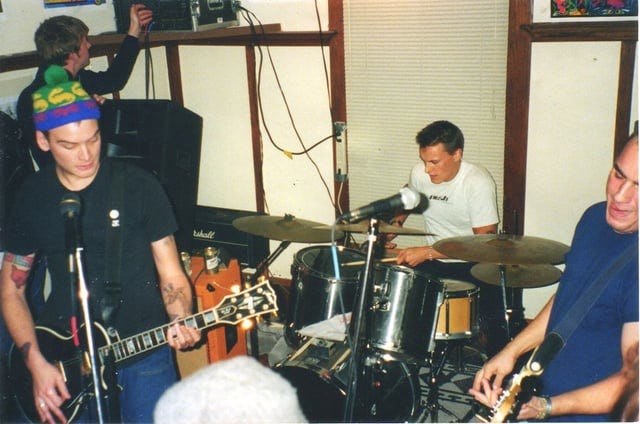 I heard you like photos of bands at house shows. Here's a classic. Alkaline  Trio in 1999. : r/poppunkers