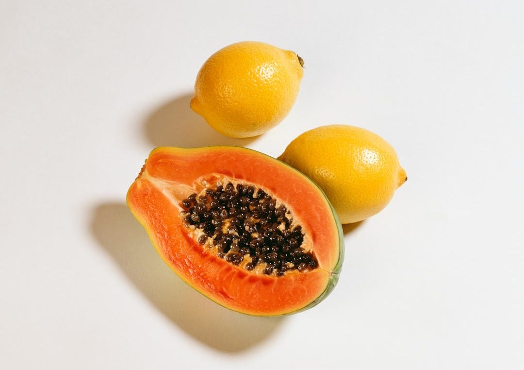 yellow papaya and two lemons