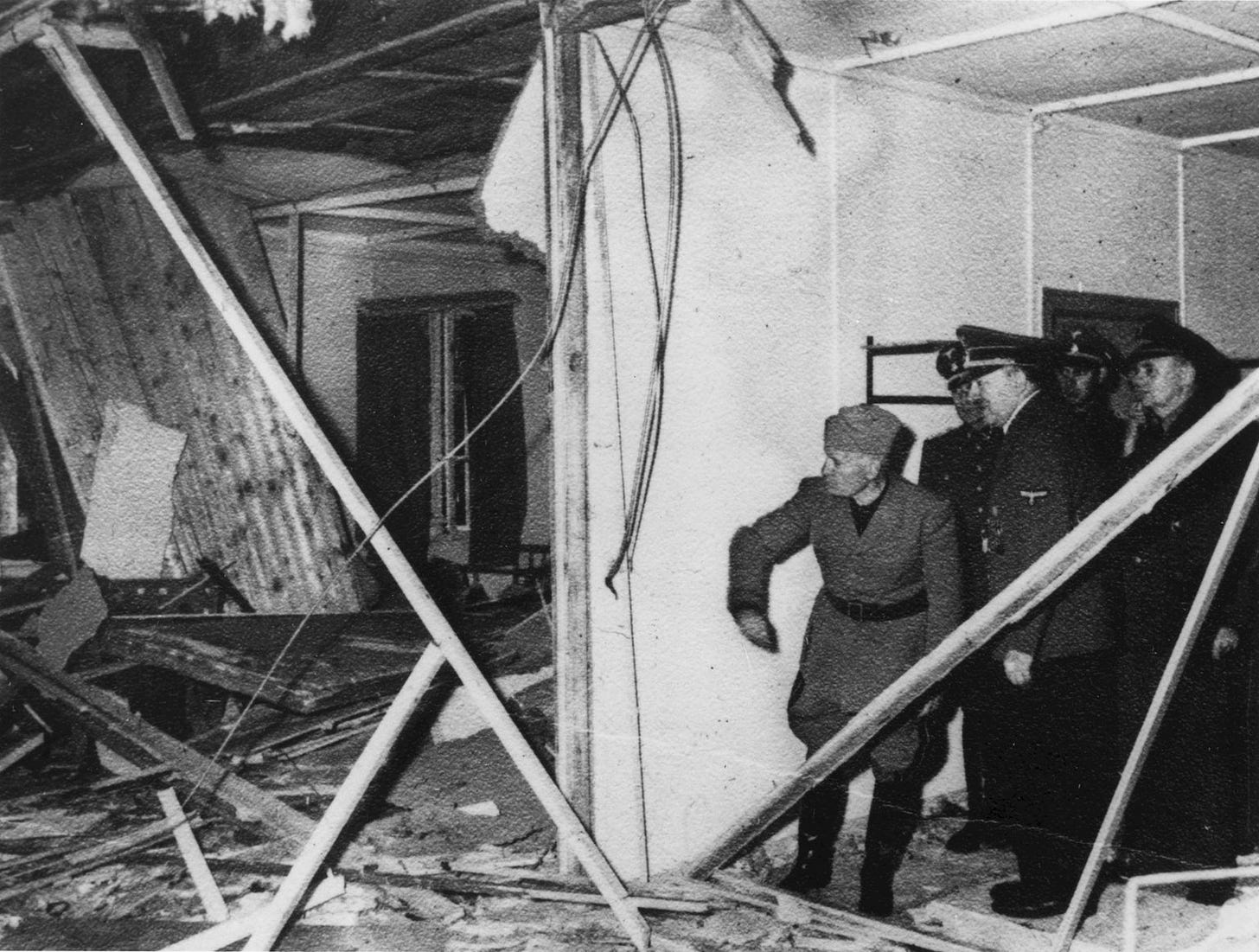 After the attempt on his life, Hitler shows Mussolini the room where the bomb went off. Wolf’s Lair Führer Headquarters (near Gierłoż, Poland), 20 July 1944.