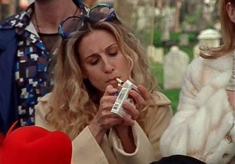 carrie from sex and the city, smoking marlboro lights in a crowd