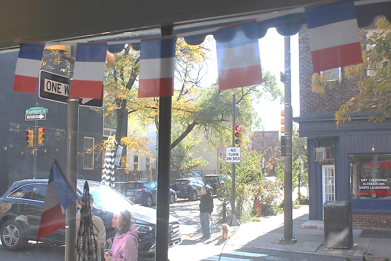 A view of a street from a window

Description automatically generated