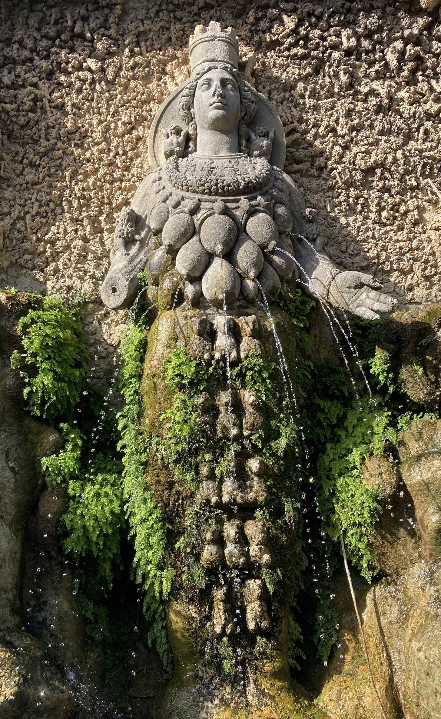 A statue of the goddess Diana, with at least 14 breasts, each spurting a jet of water. No, I'm not kidding, that's what the photo shows.