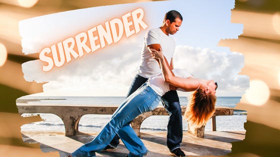 Surrender: a woman surrenders, head back, eyes closed, hair loose, into the deep dip of the man she's dancing with.