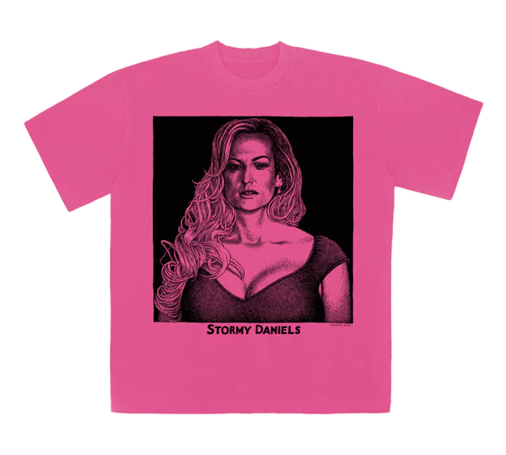 t shirt by r crumb of stormy daniels. the t shirt is pink and features an image of stormy daniels on the front