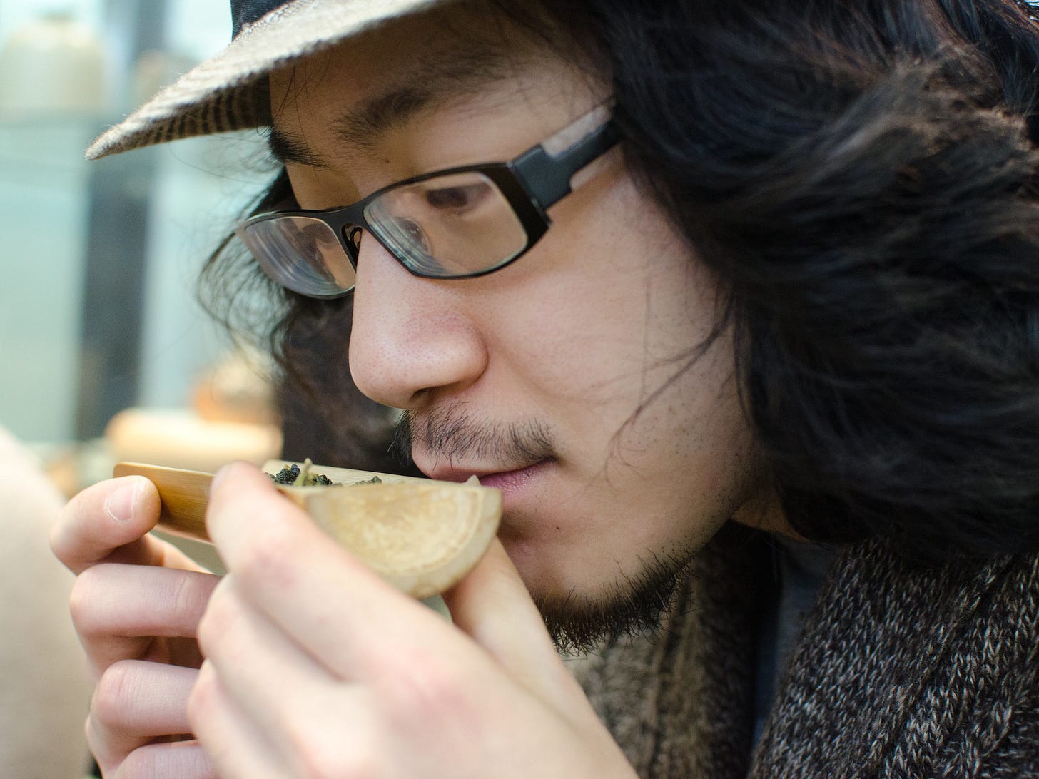 ID: Person sniffing tea leaves