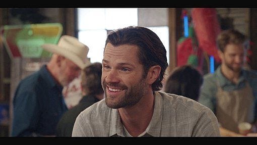 Jared Padalecki Cordell smiling as Geri looks at her chili breasts.