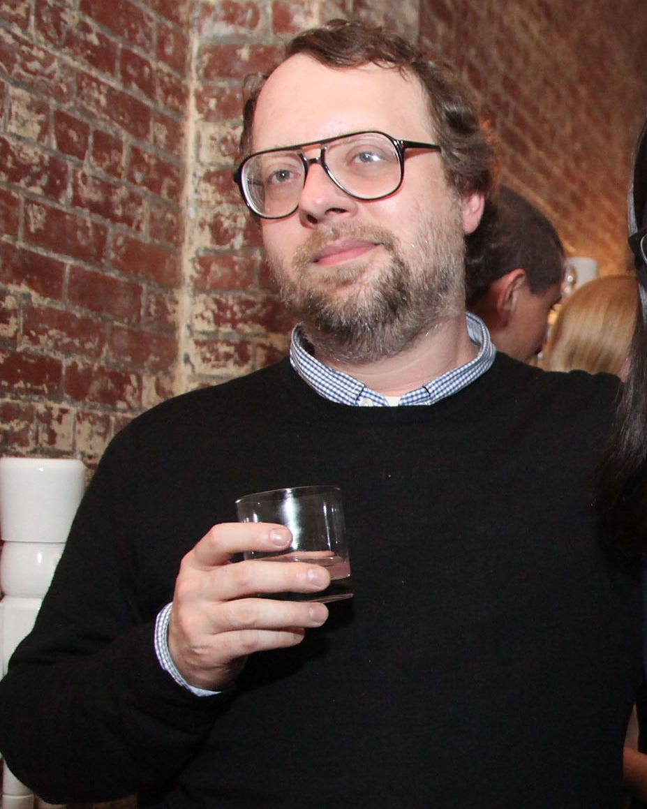 Chearno holding a glass of wine in 2011 in New York City, where he founded the Four Horsemen with LCD Soundsystem's James Murphy