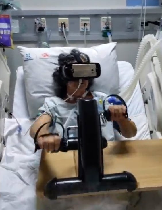 A patient in hospital exercises with a VR headset.