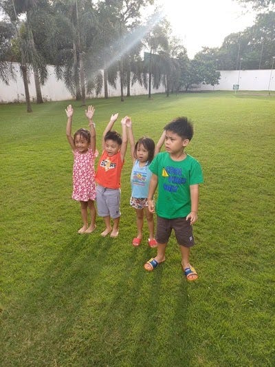 Little kids playing on the spacious grounds of Aquaboy Resort