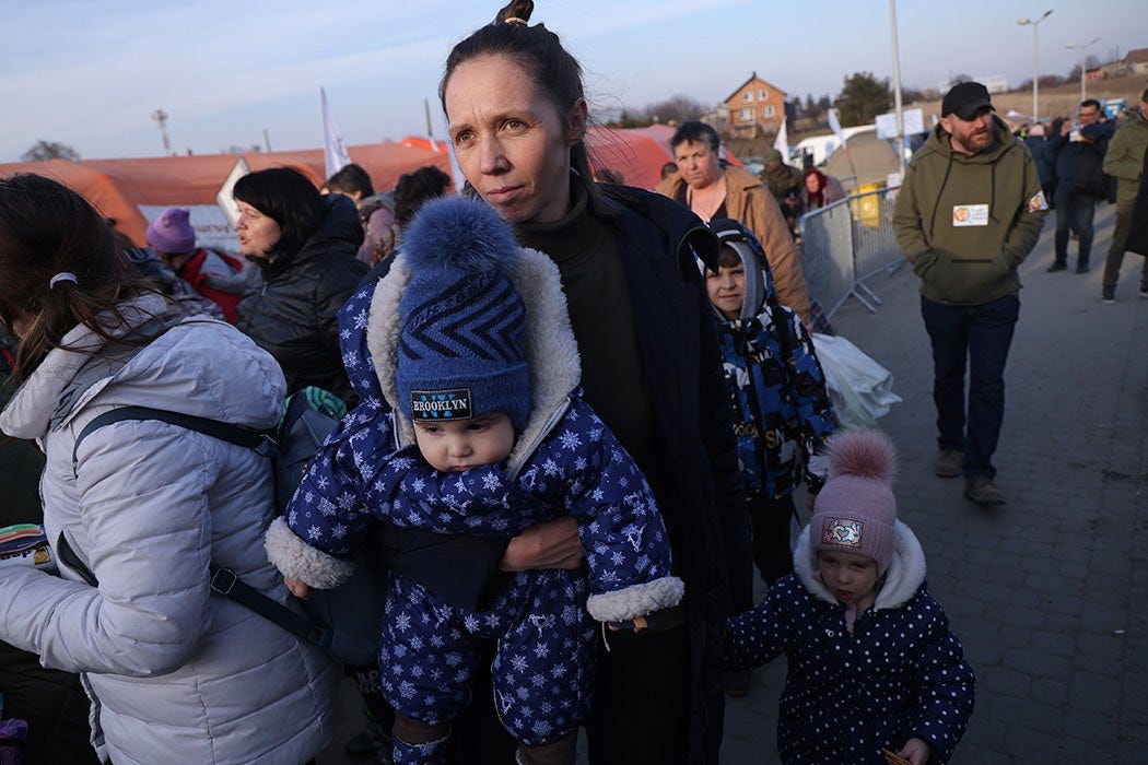 A mother arrives with her children in Poland from war-torn Ukraine.