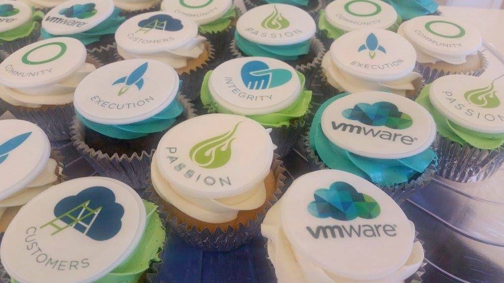 Photo of cupcakes with graphics on them that say Passion, Integrity, Customers, Community, and VMware