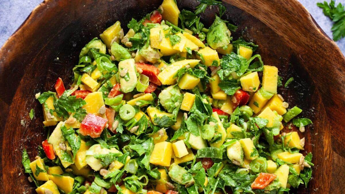 A bowl of mango avocado salad.
