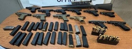 Guns & ammo seized while being smuggled from Texas into Mexico