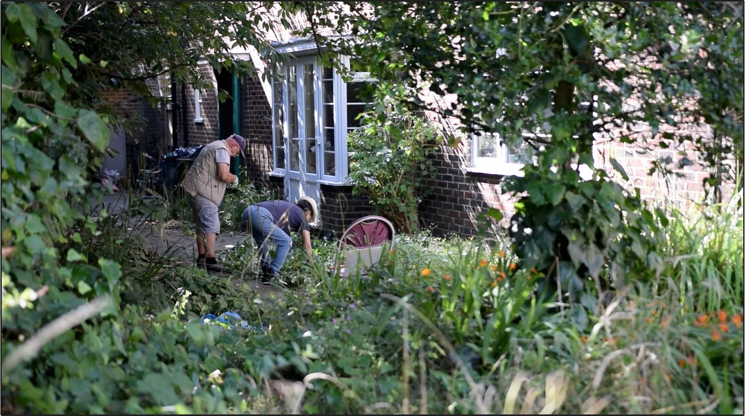 Residents tending to the community garden funded by MBLR.