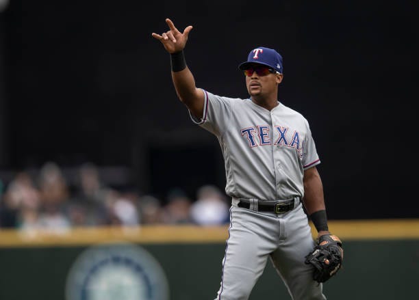 Adrian Beltre of the Texas Rangers gestures to the dugout during a game against the Seattle Mariners at Safeco Field on September 30, 2018 in...