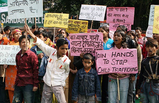 Indian children shout slogans during a protest in New Delhi on December 12, 2008 on the Global Day against Child Trafficking. Child Trafficking is a...