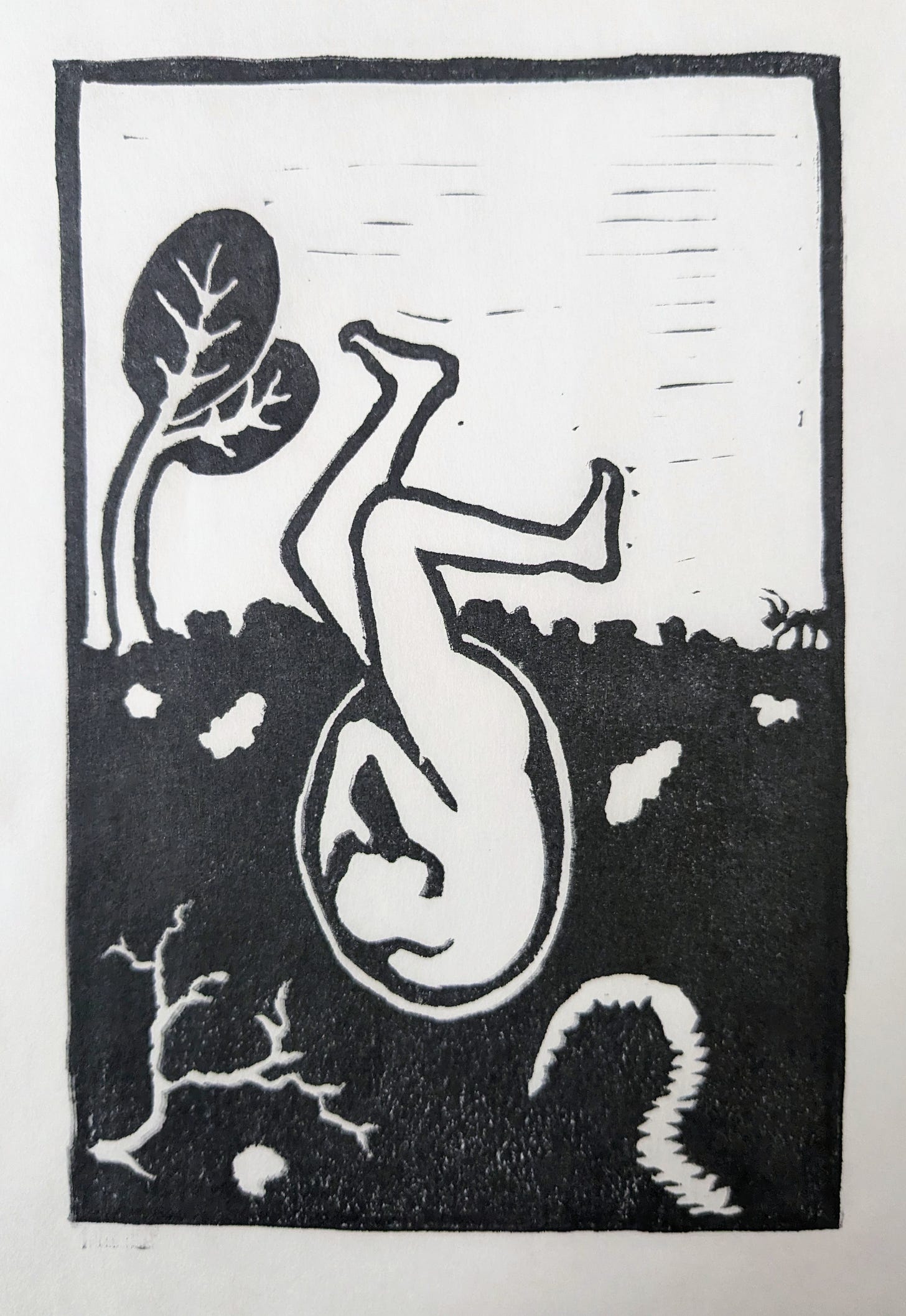 A black-and-white relief print of a person inside a buried seed, with their legs extending above the soil like seed leaves. Around the person are a seedling, an ant, an earthworm, and some roots.