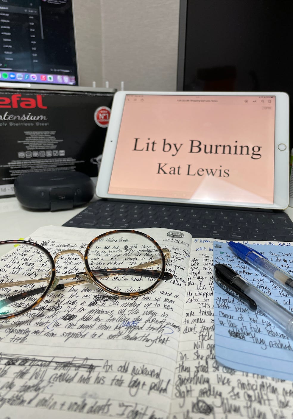 A photo of Kat's iPad open to the title page of Lit by Burning.