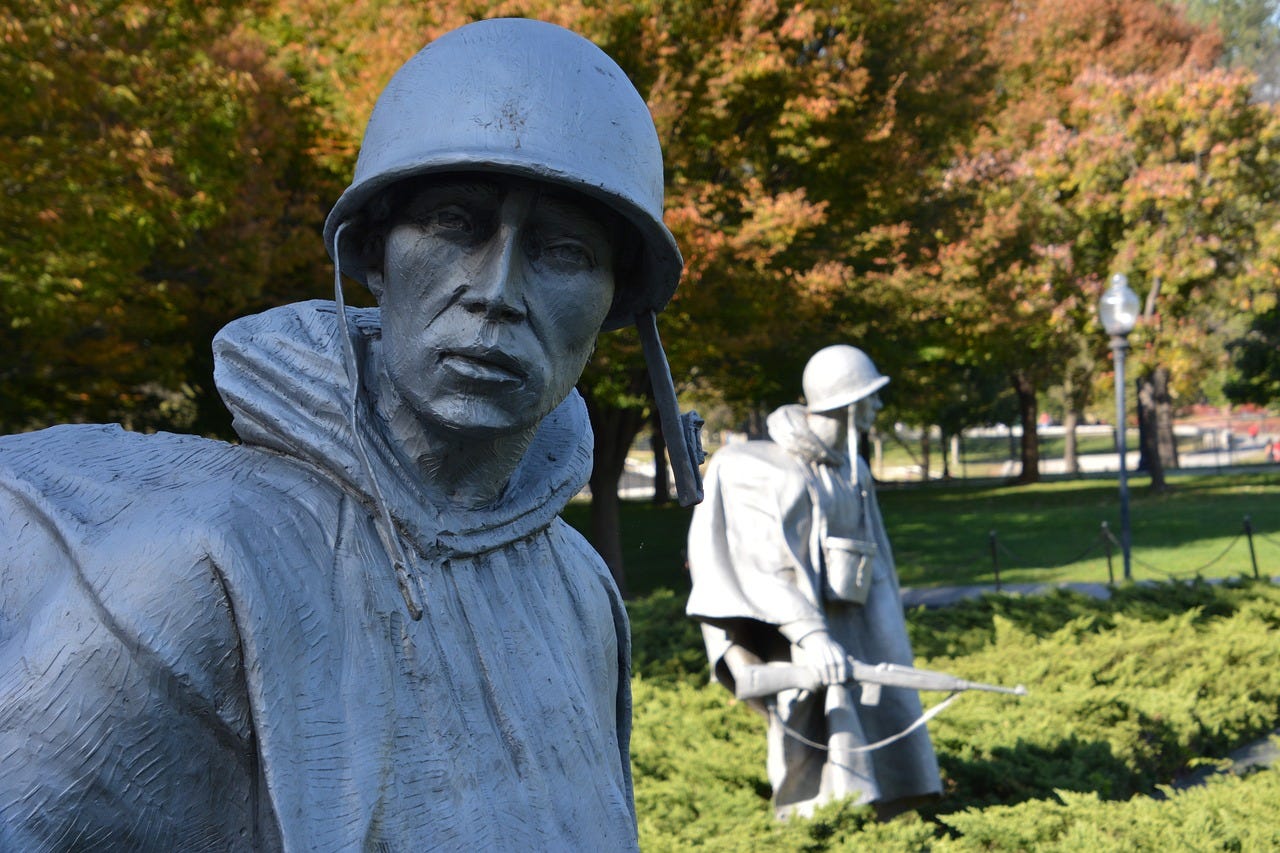 statues of emaciated soldiers in winter garb