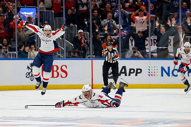 Alex Ovechkin of the Washington Capitals celebrates as he scores his 895th career NHL goal, breaking the record of 894 goals set by Wayne Gretzky...