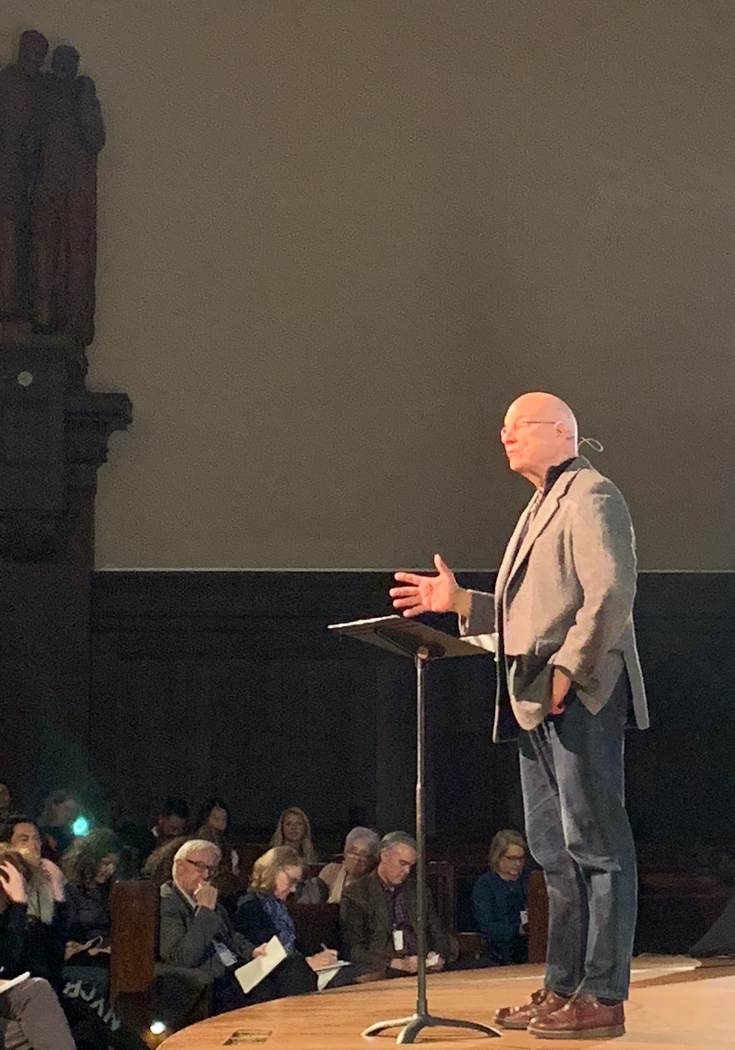 Photo of Tim Keller standing on the stage and speaking