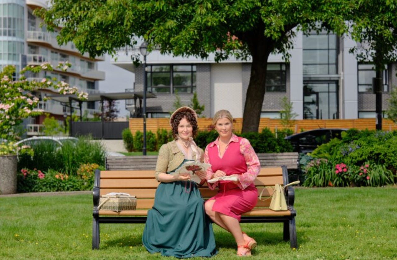 two women sitting on a bench in a park