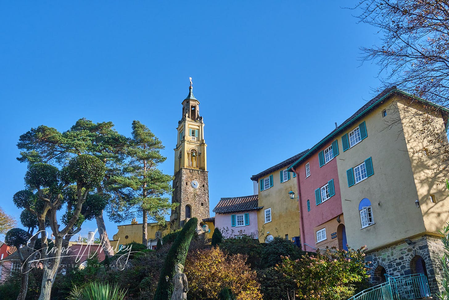 The tall, slender Bell Tower rises above rows of Italianate houses on the North Wales village of Portmeirion